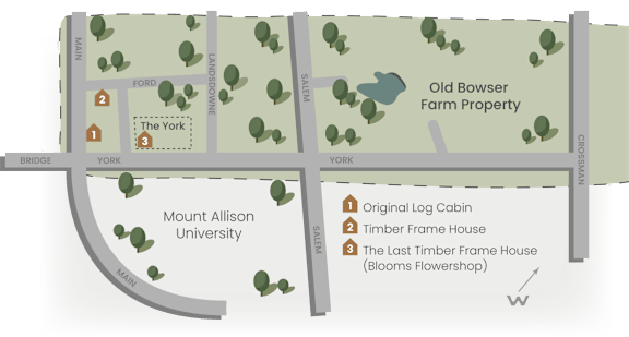 Map of a property with a log cabin, timber frame house, and a blooms flower shop.