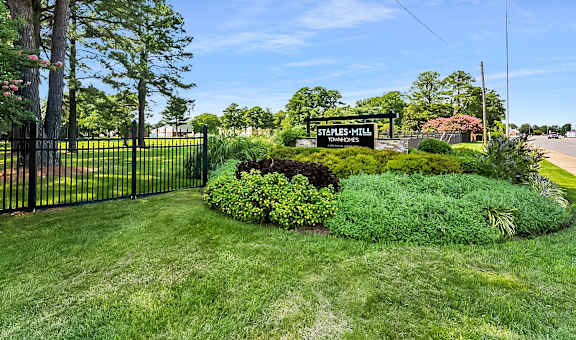 a yard with a fence and a sign for sleepy mall