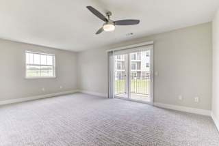 Enlarged living room with plush carpeting at Eagle Ridge Apartment Homes, Traverse City, Michigan