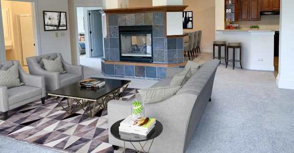 a living room with a couch and a fireplace