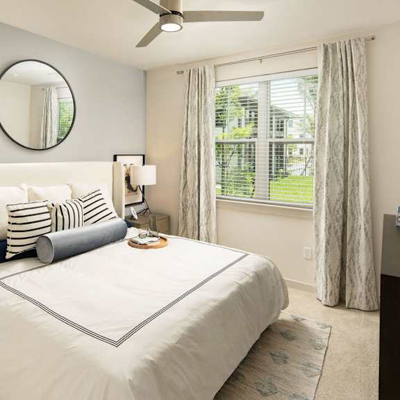 A bedroom with a large bed at Las Palmas Apartments, Fort Myers, FL 33913