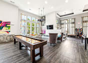 Thumbnail 14 of 31 - A modern living room with a wooden floor and a glass table.
