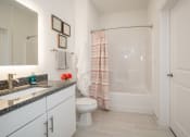 Thumbnail 6 of 35 - a bathroom with a shower toilet and sink at East 51 At Rocketts Landing, Richmond, 23231