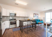 Thumbnail 2 of 35 - a kitchen and living room in an apartment at East 51 At Rocketts Landing, Richmond, 23231