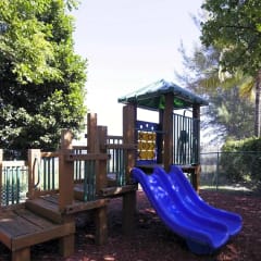 a seesaw on a playground in a park