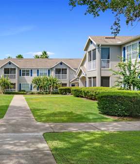 A sunny day at a residential complex with a clear blue sky.