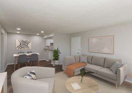 a living room and dining room with couches and a table