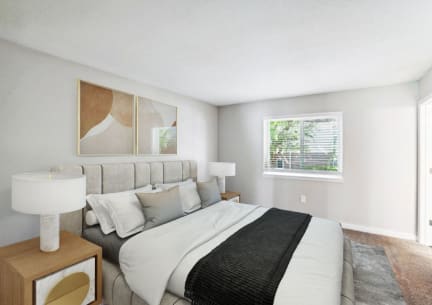 a bedroom with a large bed and a window
