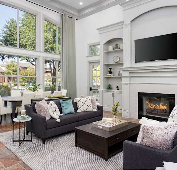 A living room with a fireplace and a couch.