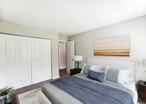 a bedroom with a bed and a closet