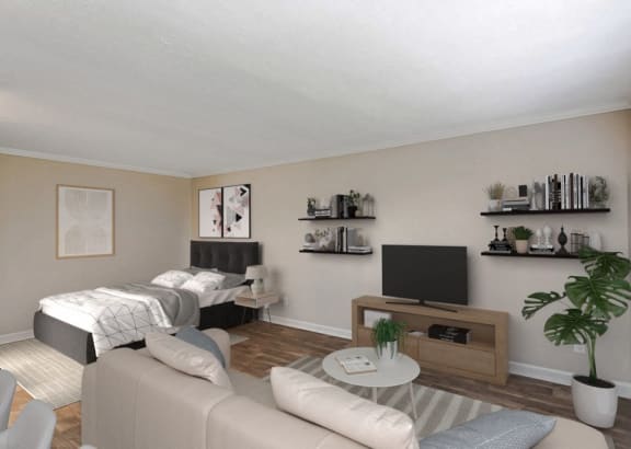 a living room with a couch and a tv and a bed
