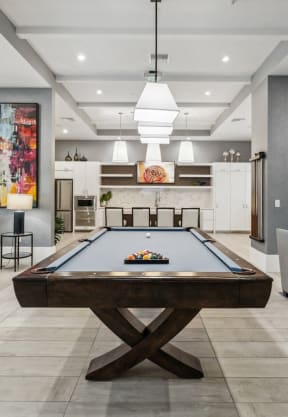 a game room with a pool table and couches  at Barcelona Jupiter, Jupiter, FL, 33458