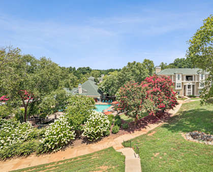 A large house with a pool in the backyard.