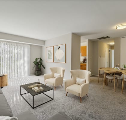 a living room with a couch and chairs and a dining room table  at Briarwood Apartments, Dumfries, Virginia