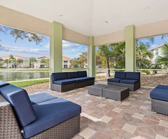 the preserve at ballantyne commons living room with couches and windows at Bay Breeze Villas, Fort Myers, FL, 33908