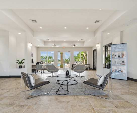 the preserve at ballantyne commons lobby with chairs and tables at Bay Breeze Villas, Florida, 33908