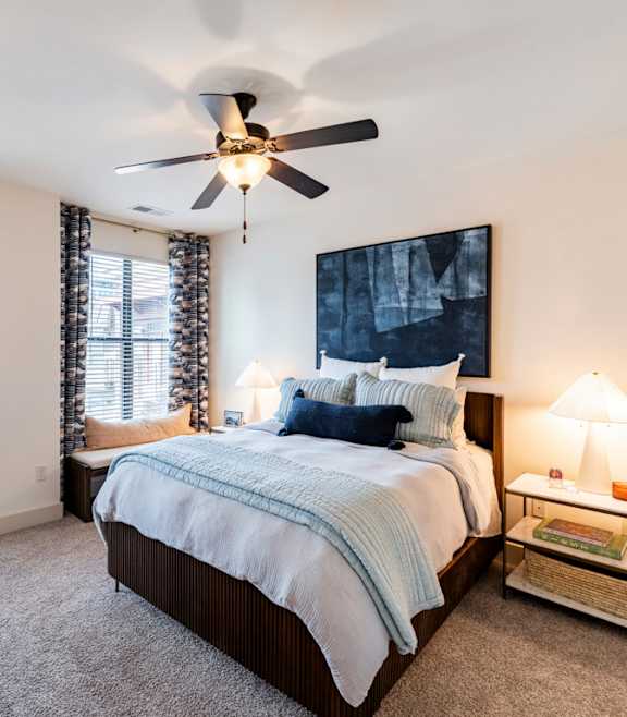 a bedroom with a large bed and a ceiling fan at Park and Kingston, Charlotte, North Carolina