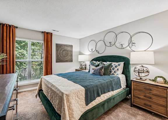 a bedroom with a bed and a dresser and a window at Park Ridge Estates, North Carolina, 27713