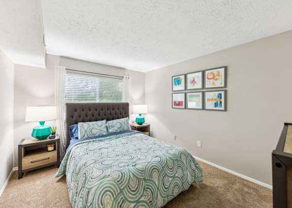 a living room with a couch and a table and a television at Chinoe Creek Apartments, Lexington, KY, 40502
