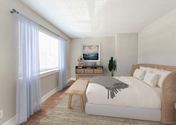A bedroom with a large bed and a window with curtains. at The Courtyards of Chanticleer, Virginia Beach, VA