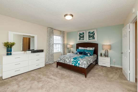 Bedroom with carpeting at The Locks Apartments, Richmond, 23219