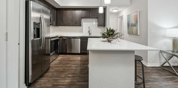 a kitchen with stainless steel appliances and a white counter top  at Barcelona Jupiter, Jupiter, FL