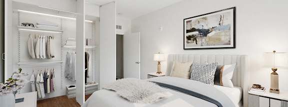 a bedroom with a bed and a closet