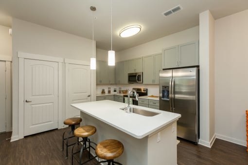 Kitchen with granite countertops and stainless steel appliances at Proximity Apartments, South Carolina, 29414