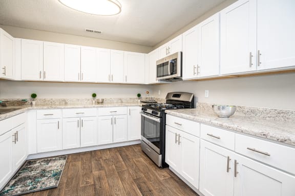 Kitchen with White Cabinetsl at Hyde Park Townhomes, PRG Real Estate Management, VA 23831