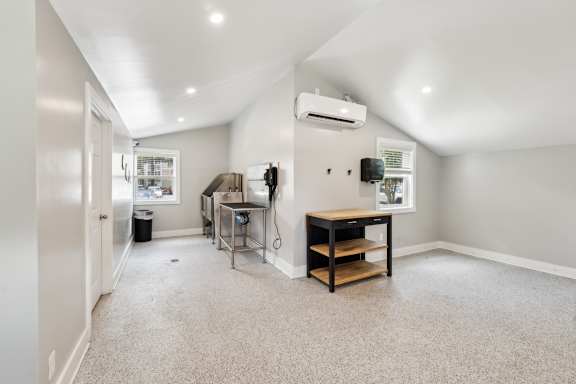 A room with a table and a window.