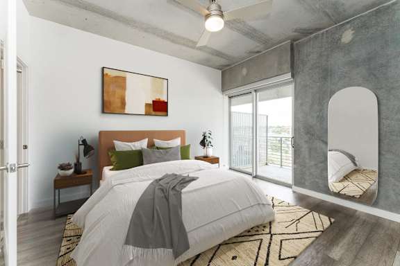 a bedroom with a bed and a large window at South Falls Tower, Richmond, VA, 23224