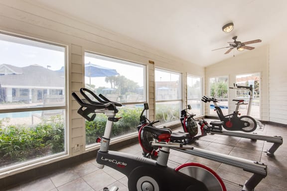 A room with a LumaCycle stationary bike in it at The Villages Apartment of Bayan Grove in Boynton Beach, FL