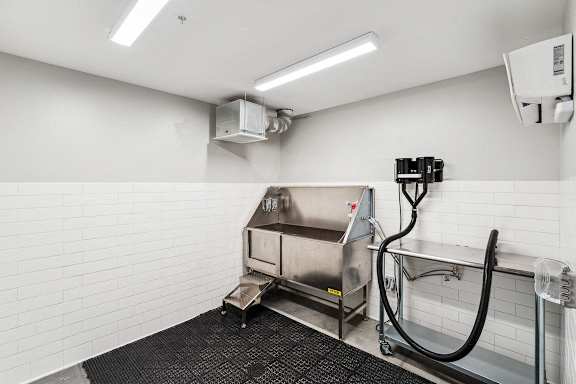 a commercial kitchen with a large stainless steel sink and