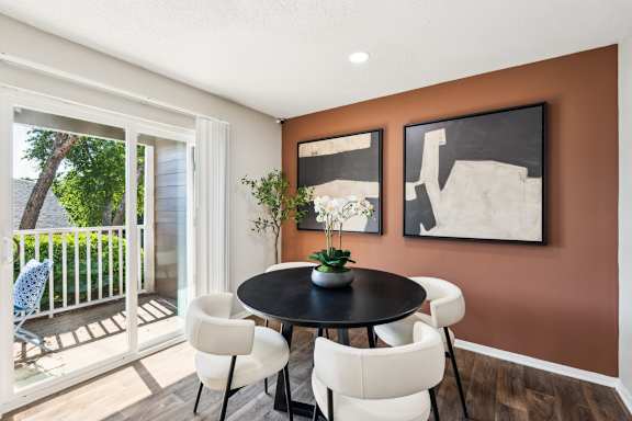 A dining room with a table and chairs. at Woodcreek Apartments, North Carolina