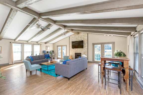 a living room with couches and chairs and a fireplace at Edgemont Apartments, PRG Real Estate, Greenville, 29615