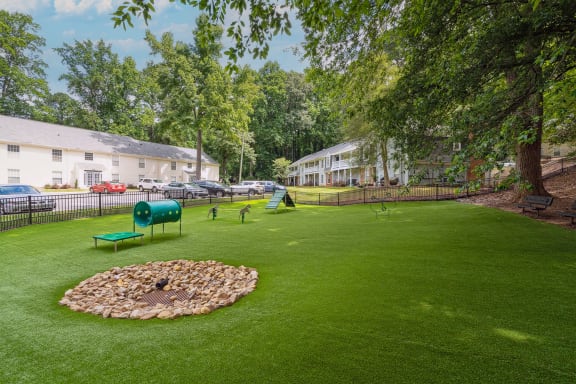 our apartments offer a dog park with a kennel and plenty of room to run at Lake Johnson Mews, North Carolina