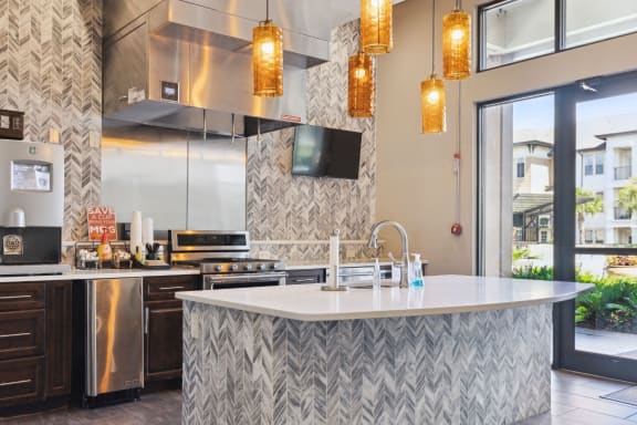 a kitchen with a large island and a large window