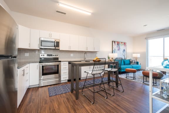 a kitchen and living room in an apartment at East 51 At Rocketts Landing, Richmond, 23231