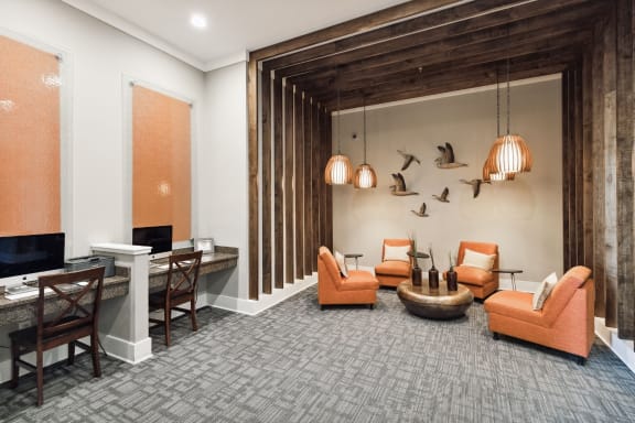 a lounge area with couches chairs and a coffee table