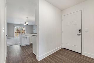 Entry way leading to kitchen with hard surface flooring at Eagle Ridge Apartment Homes, Traverse City, MI