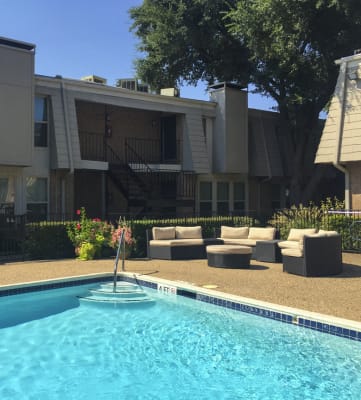 This is a photo of the swimming pool at Woodbridge Apartments in Dallas, TX.
