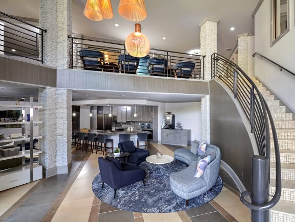 Seating area and bookshelves in newly renovated clubroom  at The Tribute in Raleigh, 27612