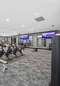 A gym with treadmills, exercise bikes, and other equipment. at Maison Apartments, Apartments, Westerville, OH