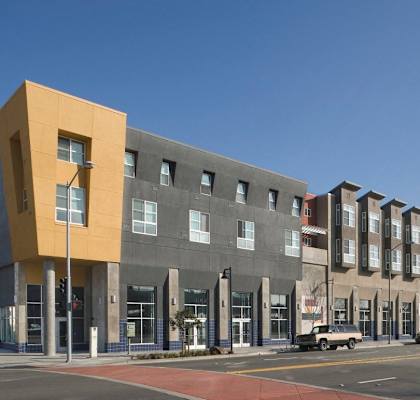 a new apartment building on the corner of a city street