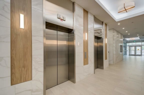 a group of elevators in a lobby of a building