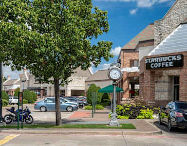 A Starbucks Coffee sign is on a building.