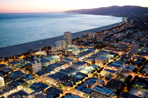 a city by the beach at night