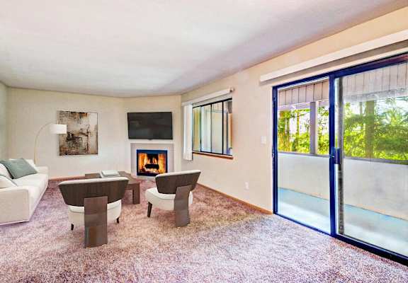 a living room with a couch and chairs and a fireplace at Autumn Village, Milton, WA, 98354