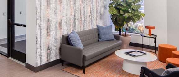 a living room with a couch and a table