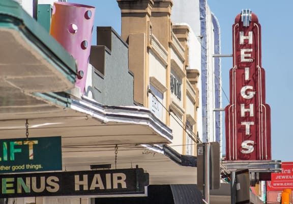 a sign for a hotel on a city street